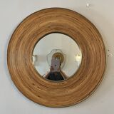 Large round mirror in rattan and brass