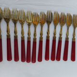 Twelve bakelite handle cake forks