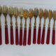 Twelve bakelite handle cake forks