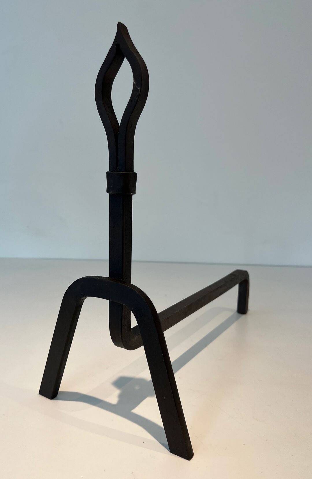 Pair of Modernist Andirons in Wrought Iron with Stylised Torches and Bases Ang