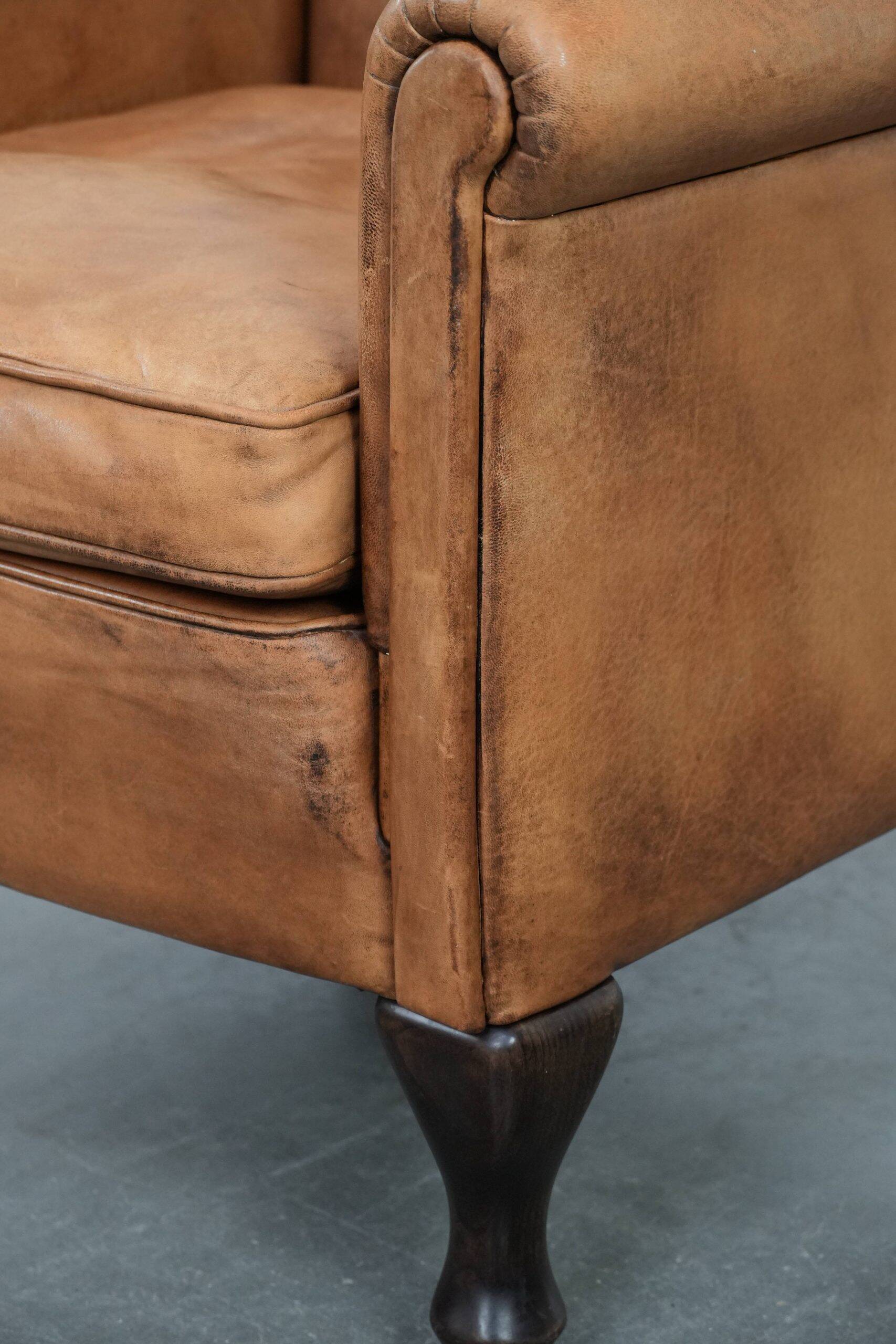 Beautiful subtle vintage sheepskin armchair with elegant legs