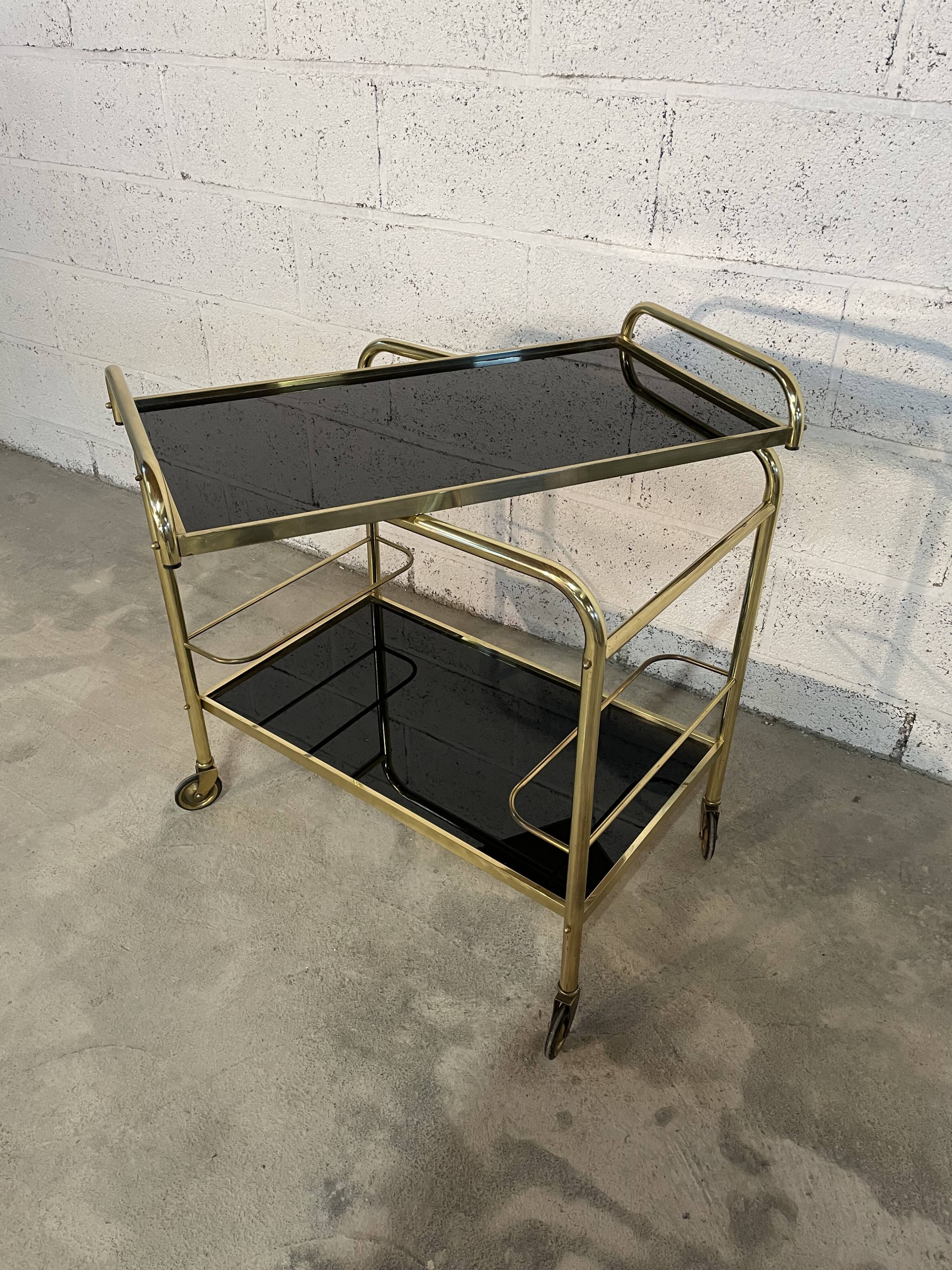 Vintage golden and black rolling service 1970s