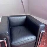 Black leather designer armchair – an elegant piece