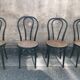 Two pairs of black 50s chairs - number 18 - cannée