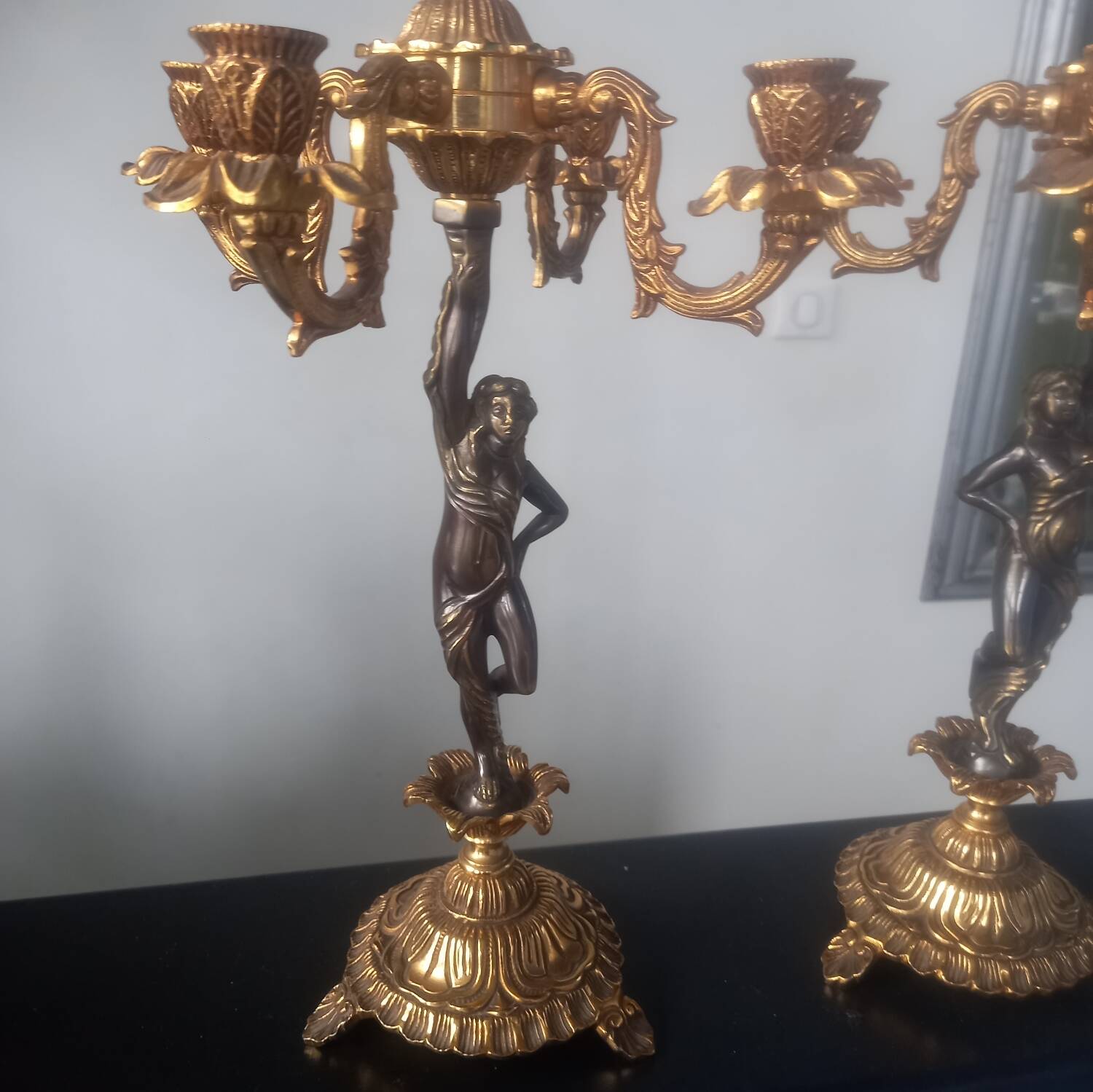 Pair of gilded bronze candlesticks with nude women
