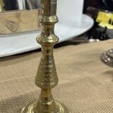 2 gold colored candlesticks
