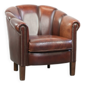 Fauteuil club en peau de mouton vintage au design original.