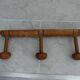 Wall-mounted coat rack made of turned wood imitating bamboo, 3 hooks.