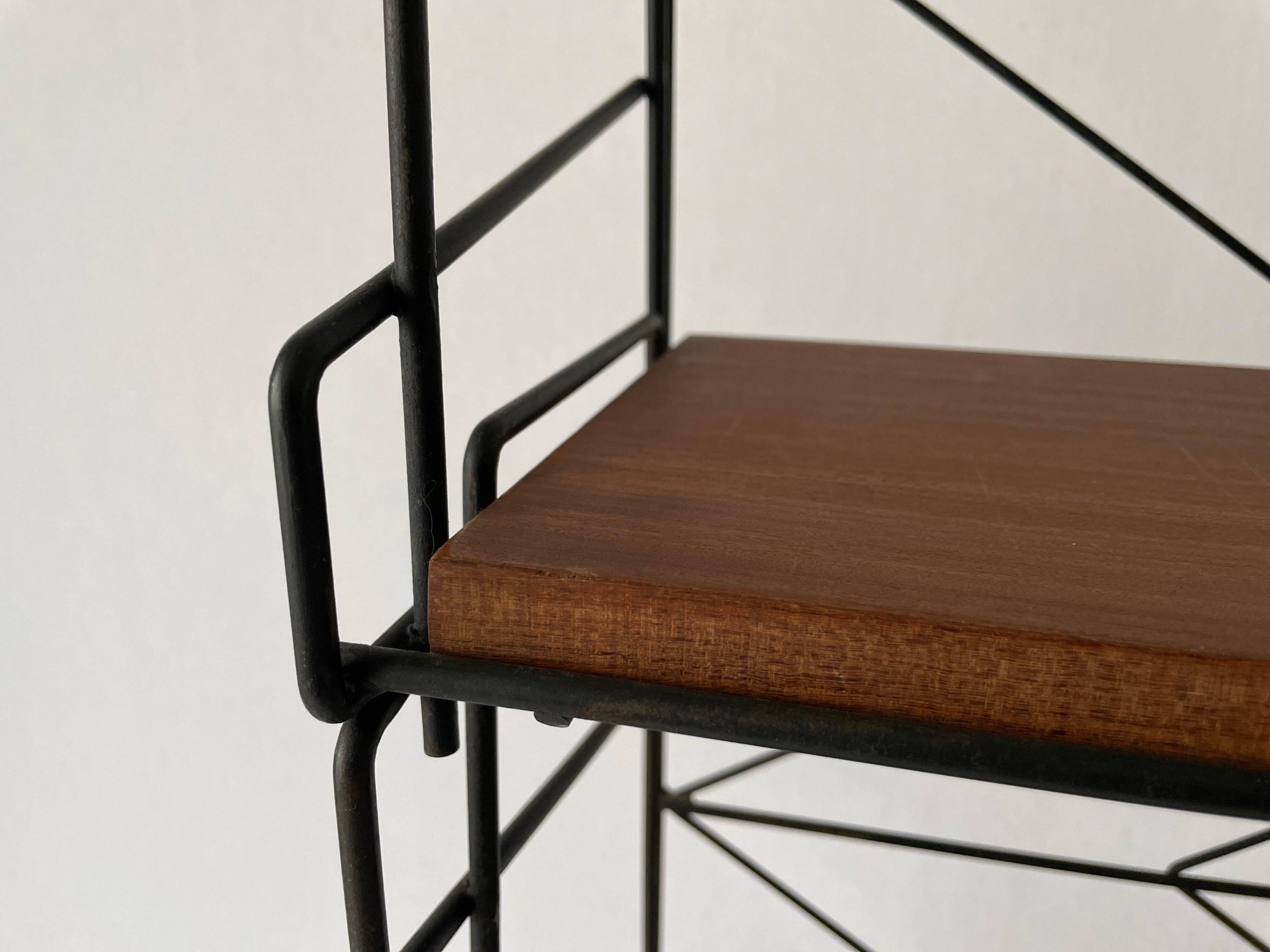 Free-standing shelf with a metal structure and 3 shelves, 1960s, Italy.