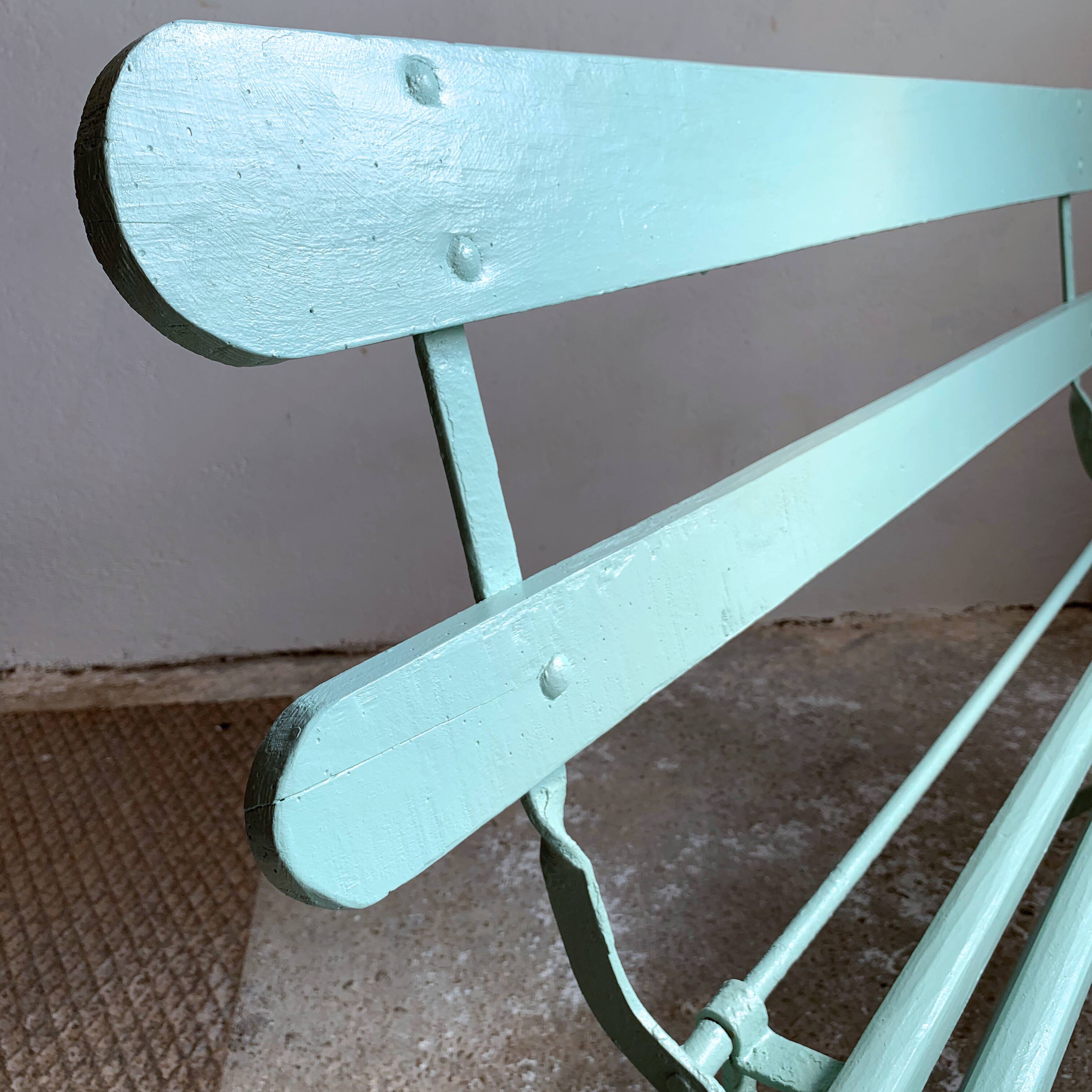 Former folding garden bench with wooden and metal slats
