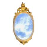 Old oval mirror in gilded resin - baroque style - 73 cm