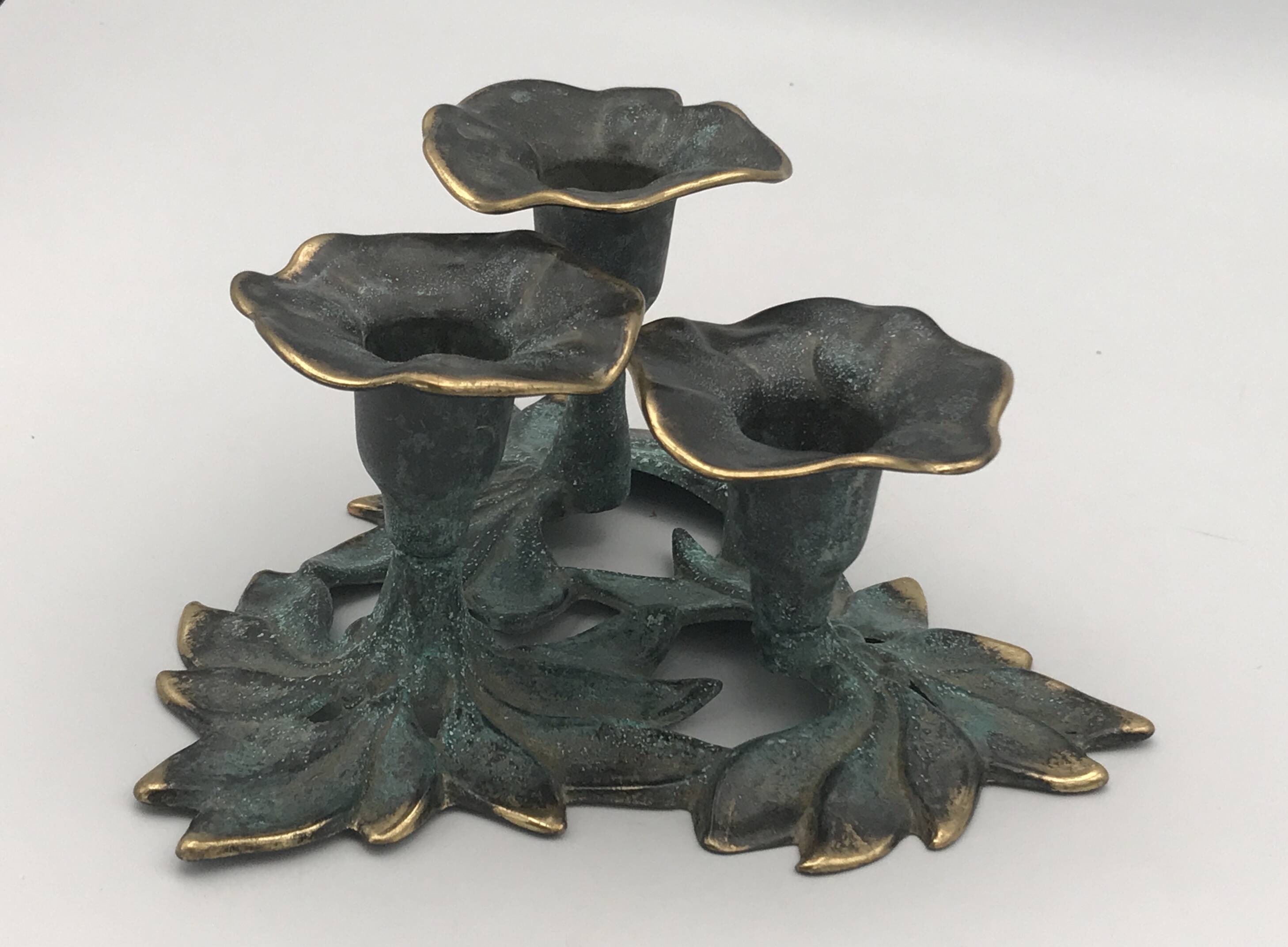 3-flower brass candlestick with green patina