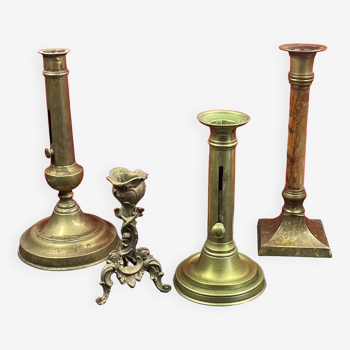 Set of 4 disparate brass candlesticks