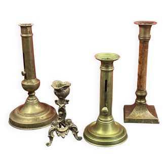 Set of 4 disparate brass candlesticks