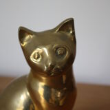 Cat sitting in brass