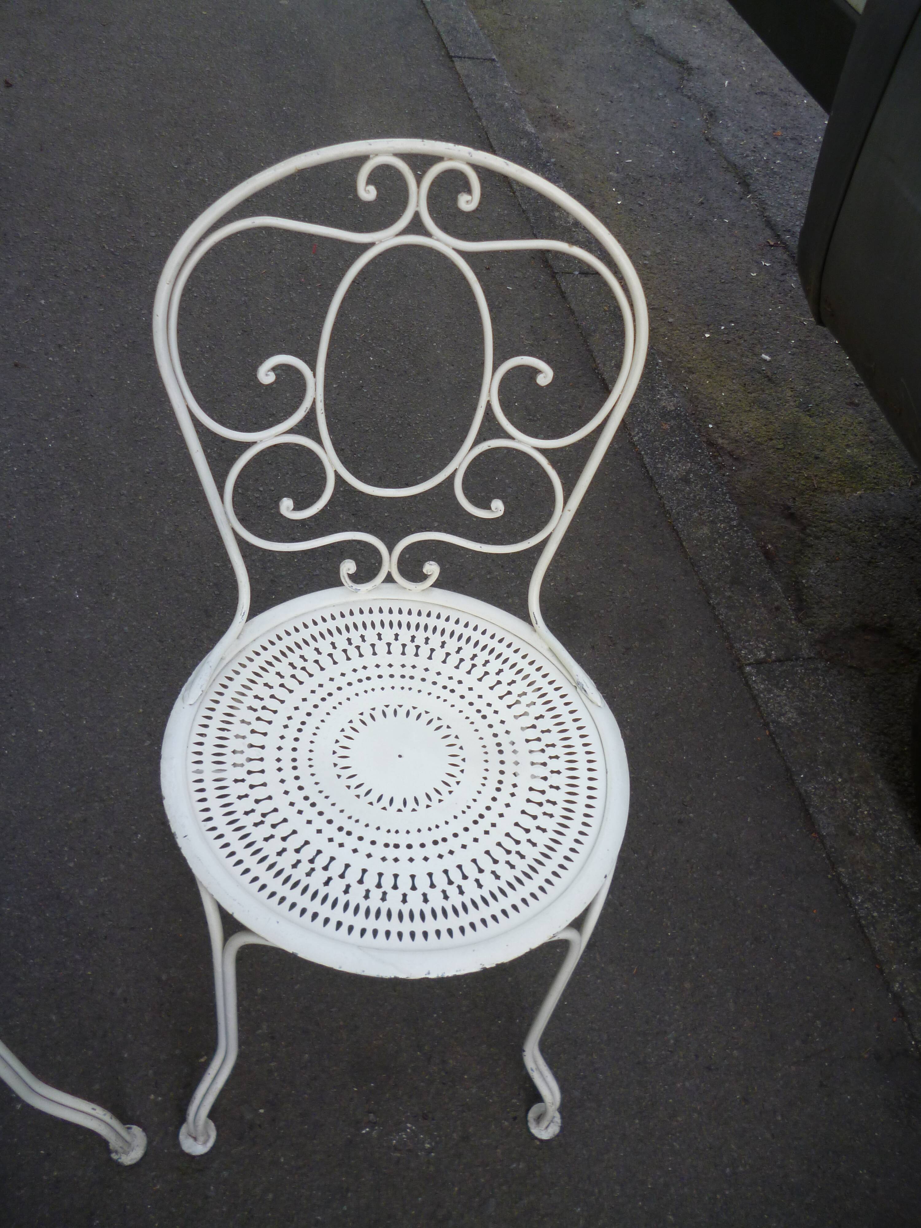 Pair of old wrought iron garden chairs