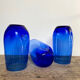 3 blue colored long drink glasses