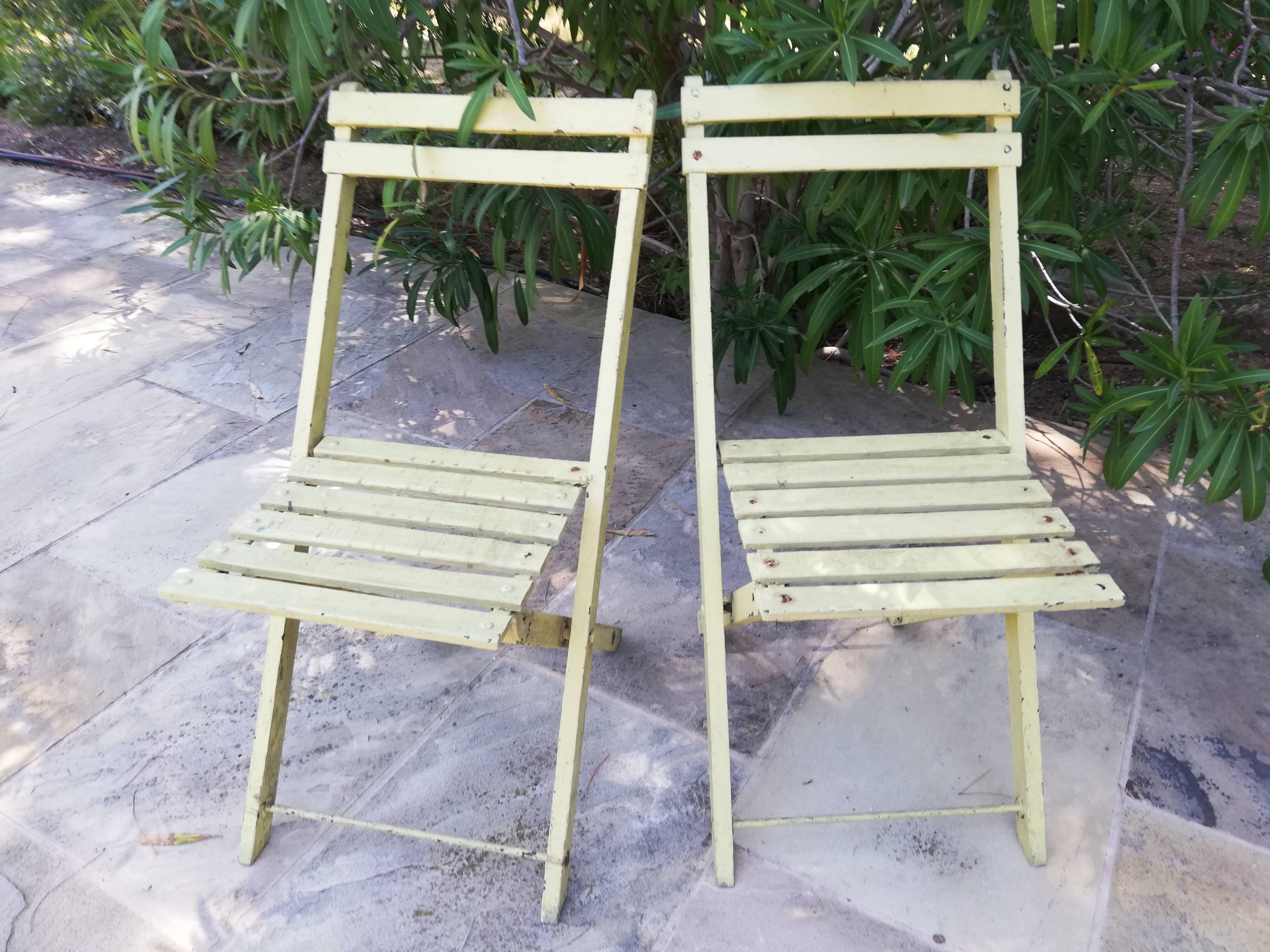 Two folding garden chairs