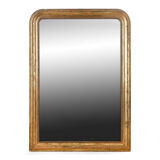 Mirror with golden patina
