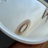 Oval mirror in white lacquered metal