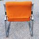 Pair of designer armchairs in orange fabrics and chrome tubes from the 70s