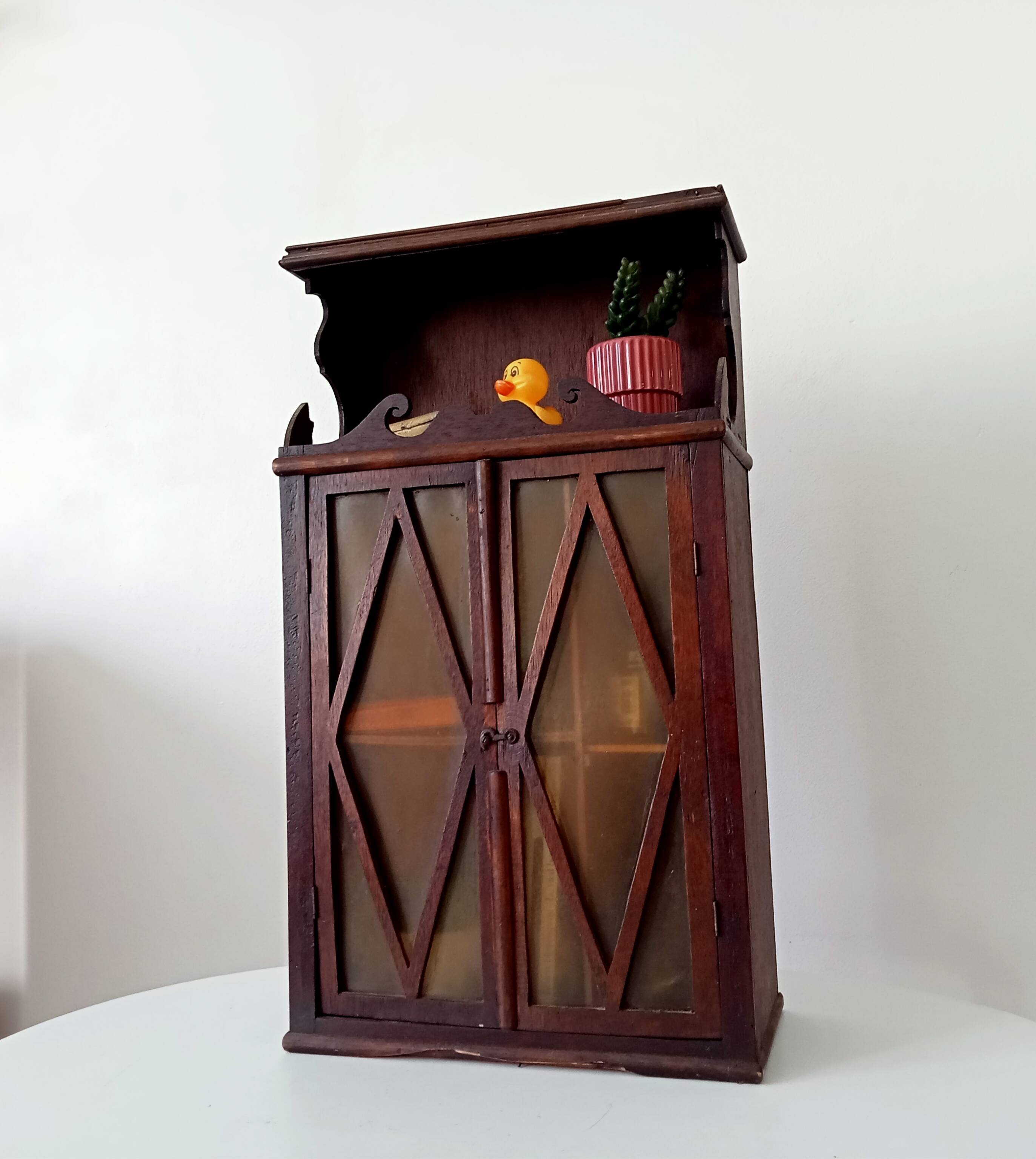 Small antique wall cabinet in Gothic style.