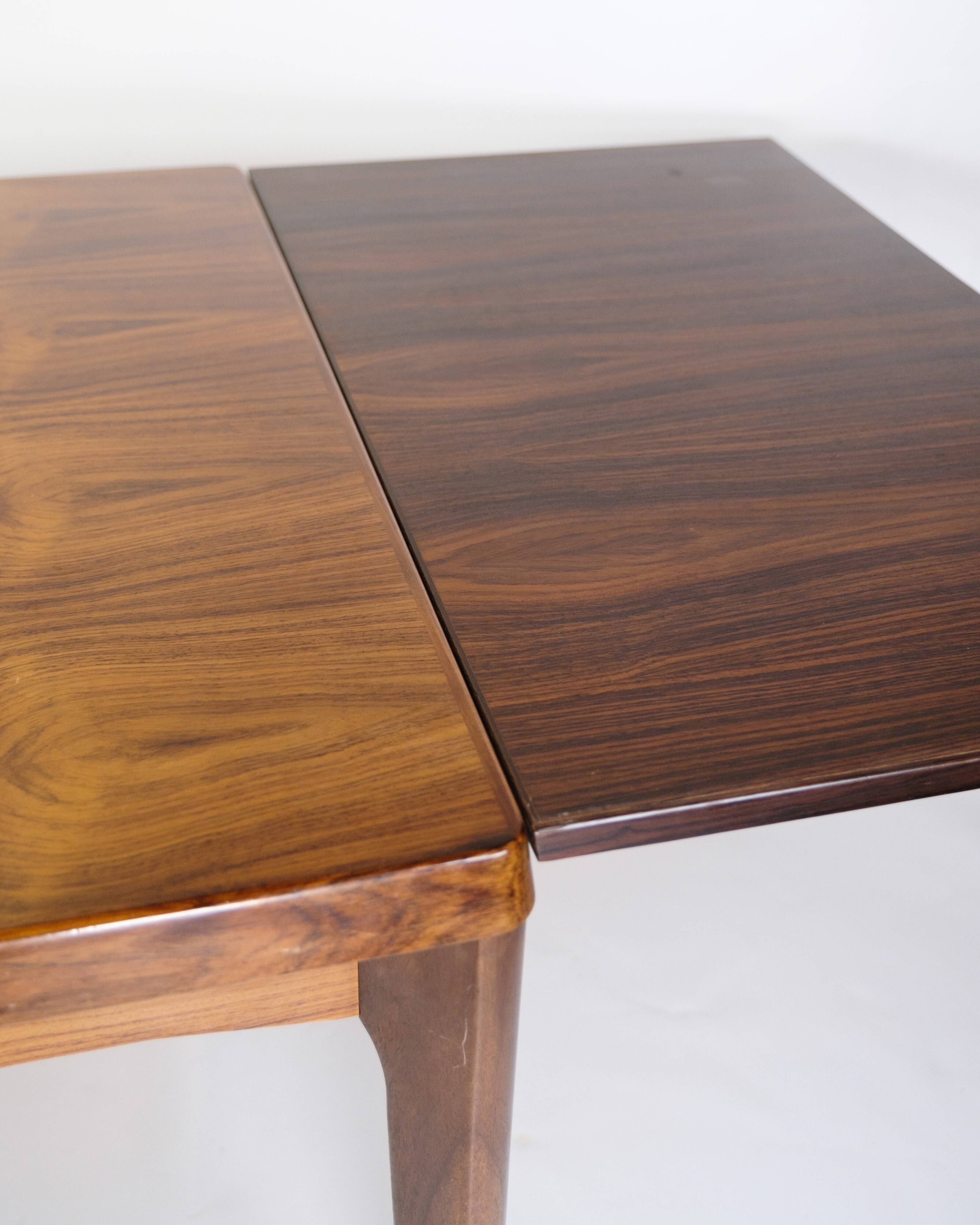 Dining Table With extensions Made In Rosewood By Henning Kjærnulf From 1960s