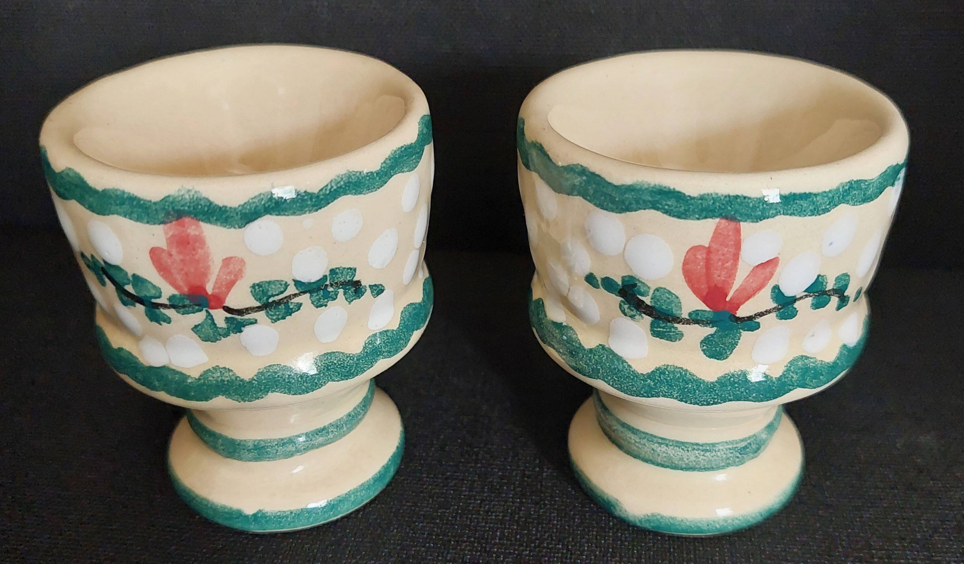 Pair of vintage earthenware egg cups with hand-painted decoration