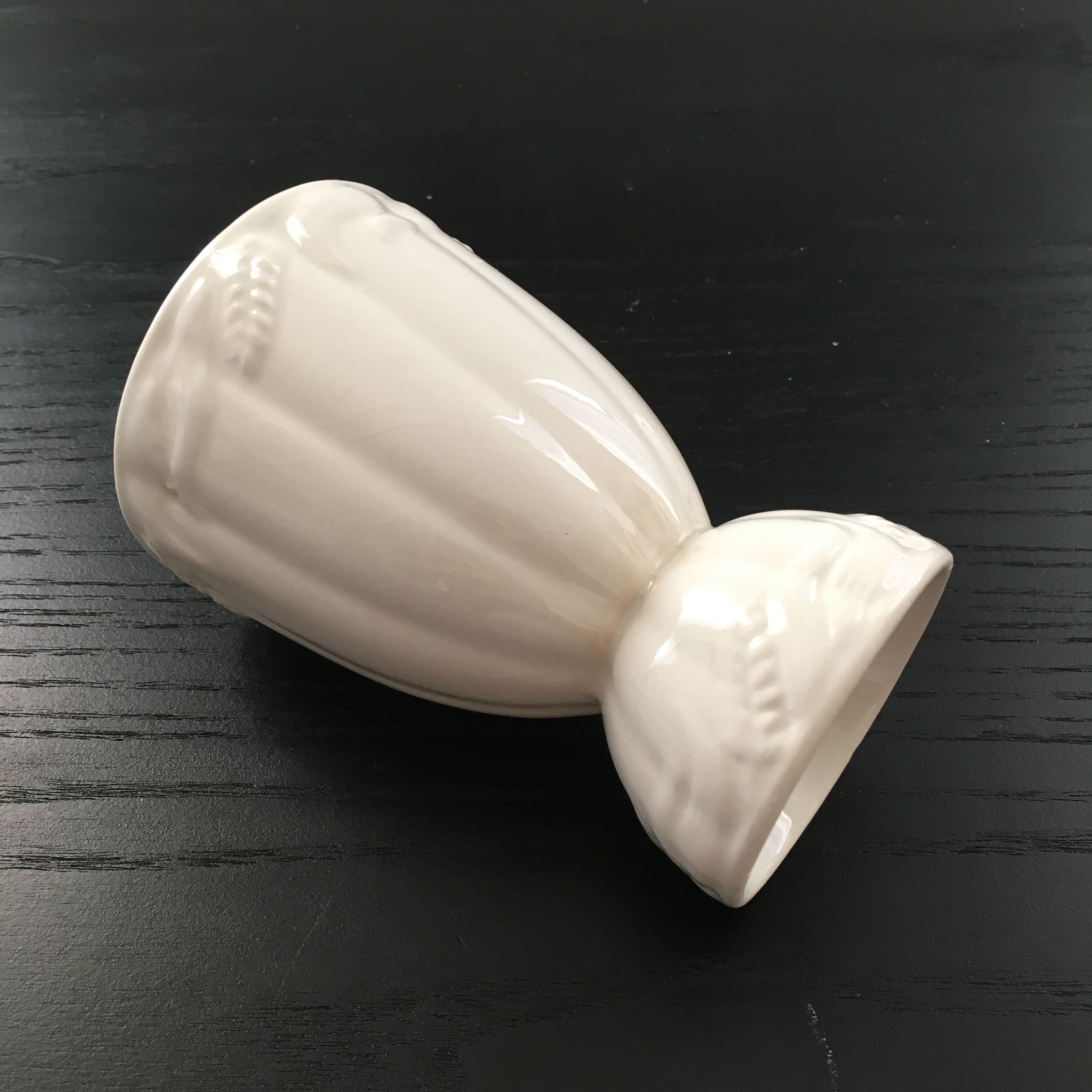 White vase with wheat decoration.