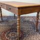 Cherry wood desk with a leather top.