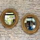 Pair of antique oval mirrors gilded with gold leaf and mercury.