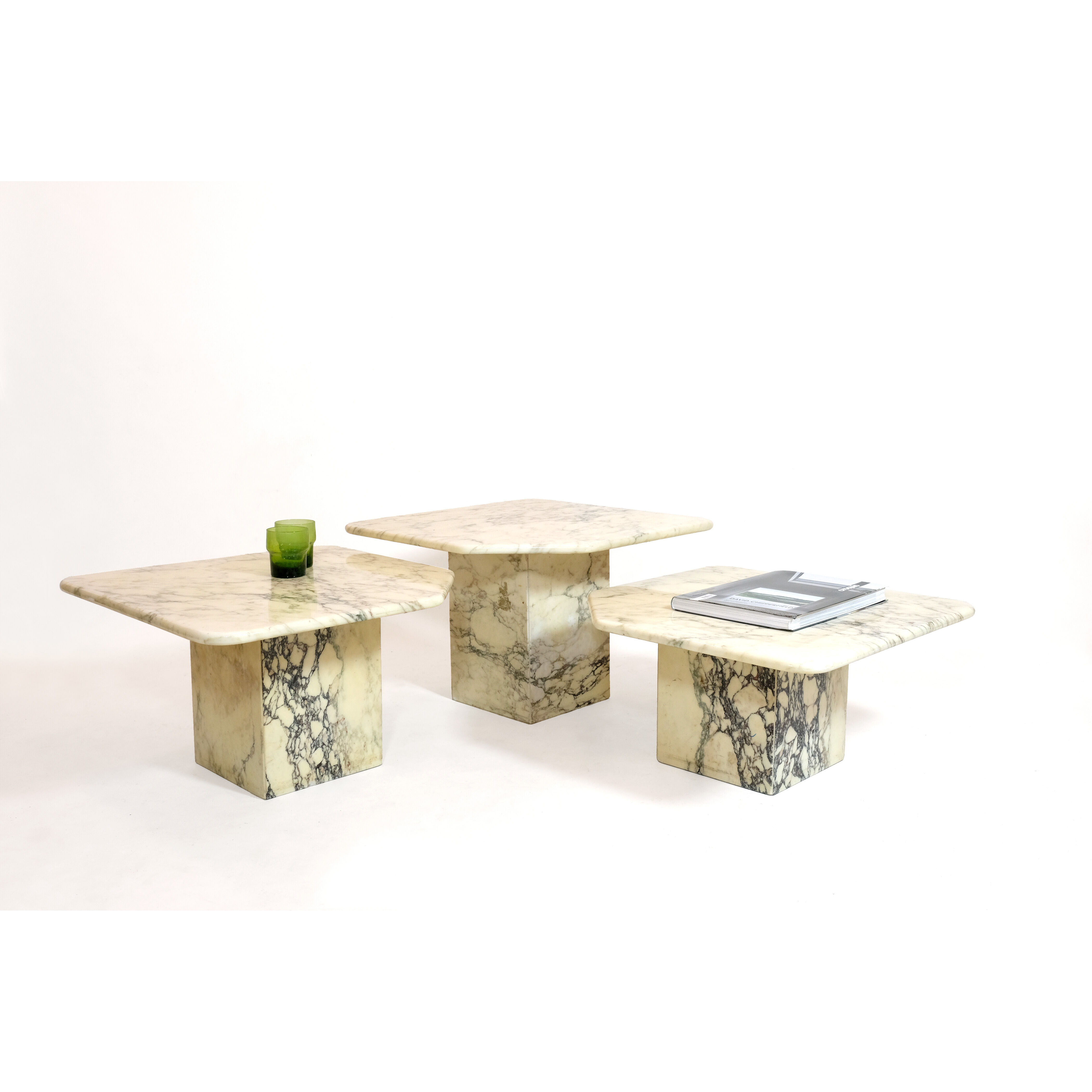 Suite of three marble trundle tables, 1970s