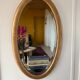 Miroir doré ovale ancien glace biseautée
