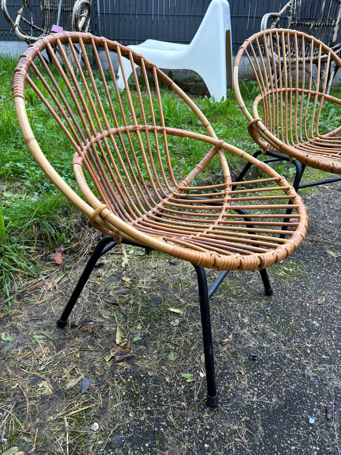 Vintage rattan armchair with metal legs