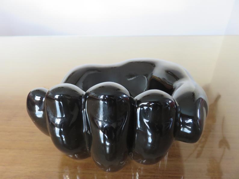 "hand" in black ceramic trinket bowl 60/70