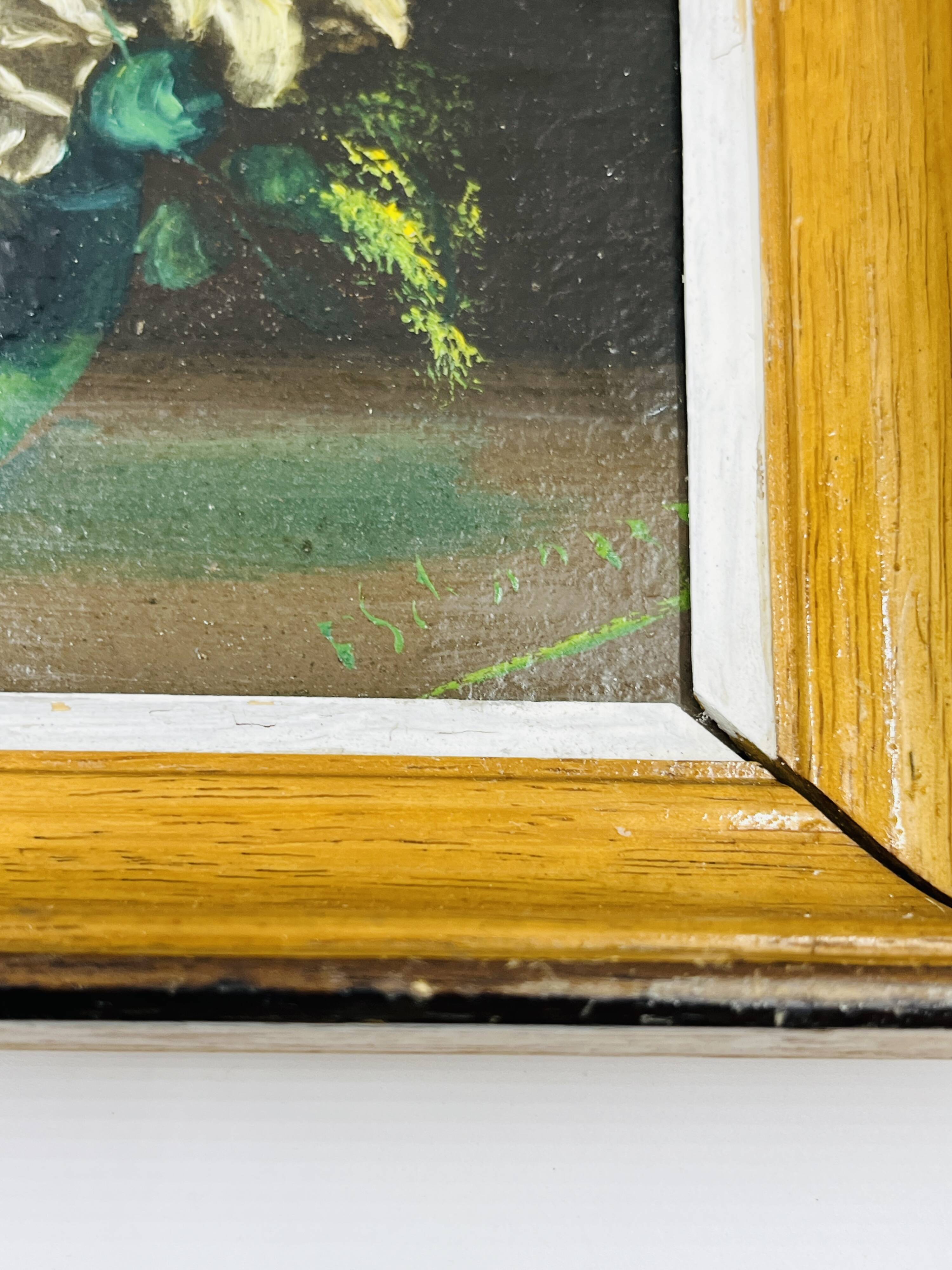Pair of small framed vintage floral oils