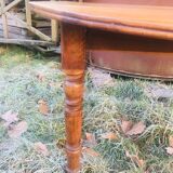 Extendable round table in walnut wood 1930