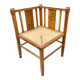Art Deco corner chair with caning