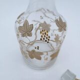 Old crystal carafe with golden decoration