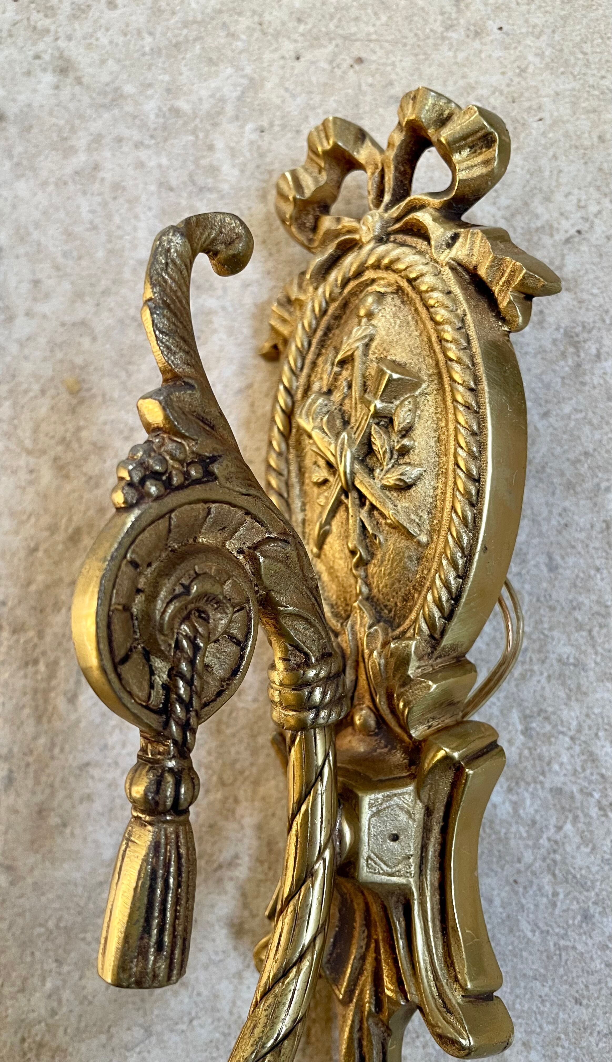 Pair of gilded bronze wall lamps Louis XVI style