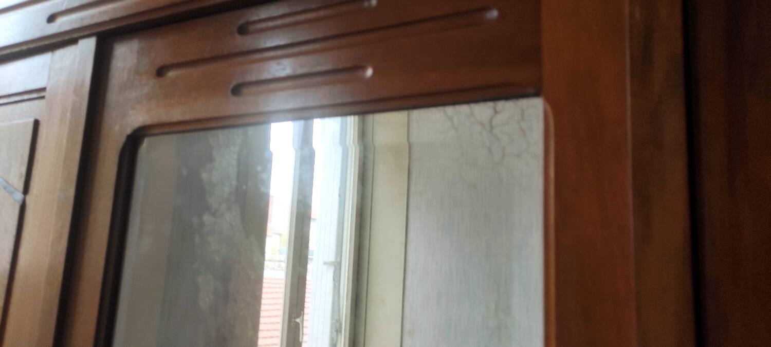 Old art nouveau 3-door wardrobe with mercury mirror