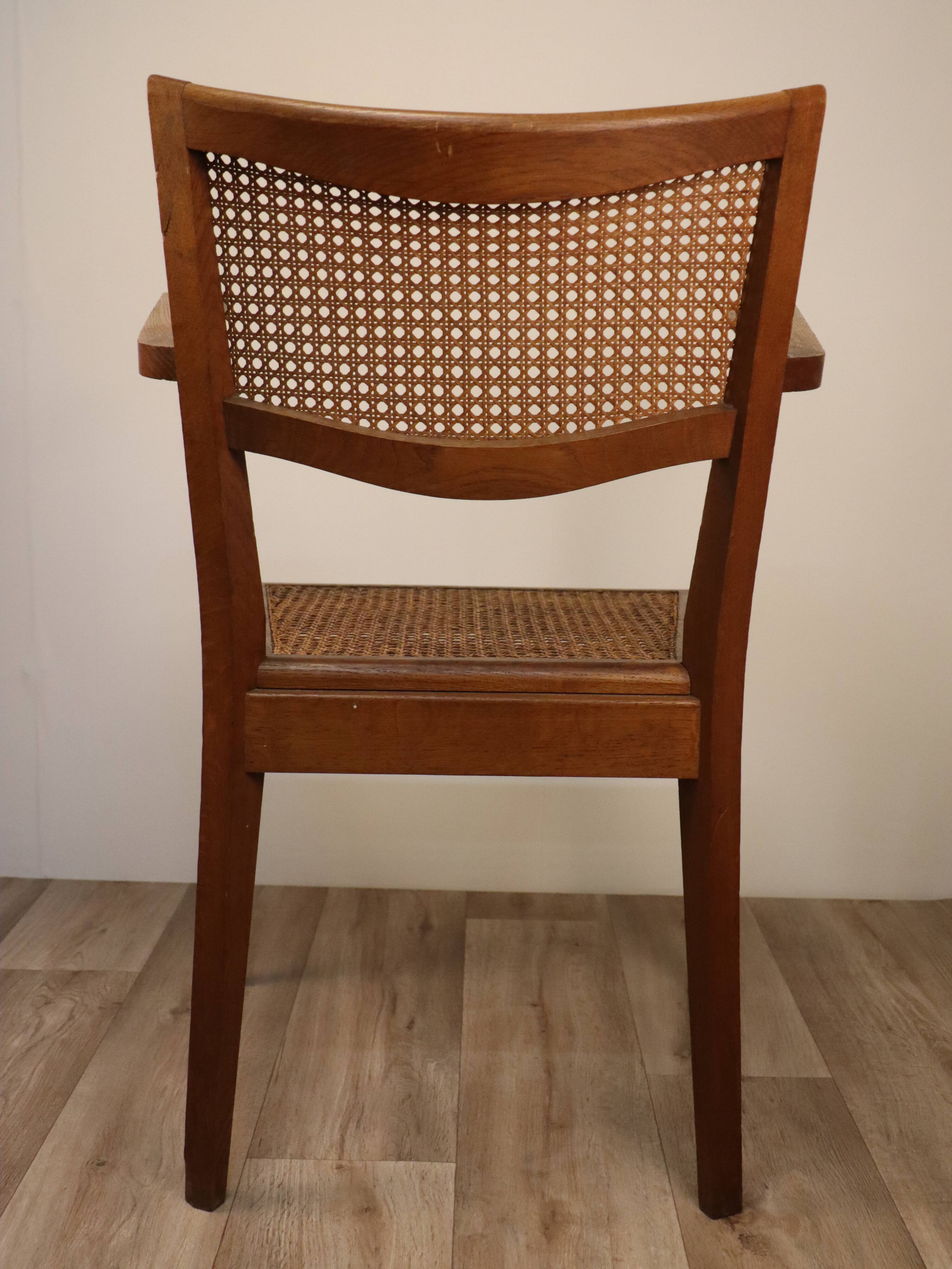 Vintage wooden armchair and canning 1950