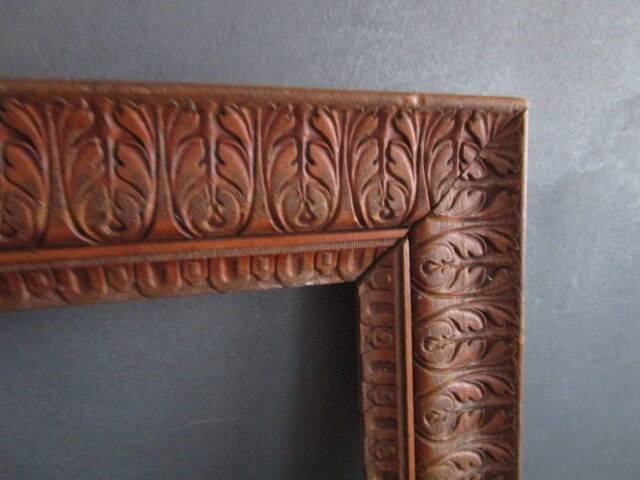 Large old frame in worked wood