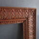 Large old frame in worked wood