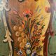 Alsatian bonnet maker in painted softwood with floral decorations