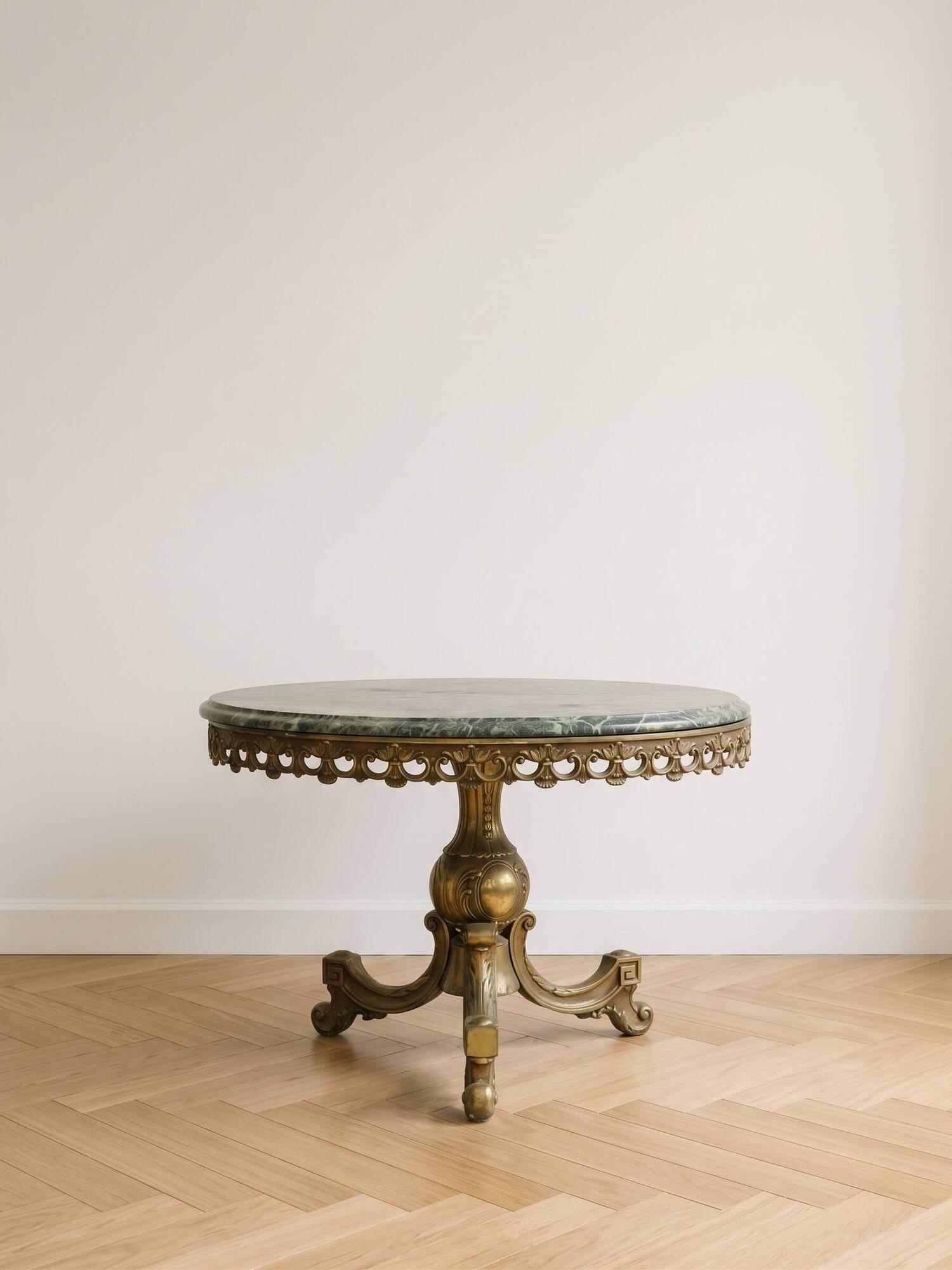 Antique coffee table in green marble and gold metal.