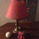 Table lamp at the foot candlestick