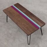 Solid oak coffee table with colored bands on pin legs