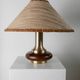 Lot of 2 vintage table lamps from the 1970s, dark wood oval bases with curved brass details, handmade natural fibre lampshades, elegant lighting.