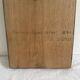 Wood sculpture bas-relief of man, woman, and child, signed.